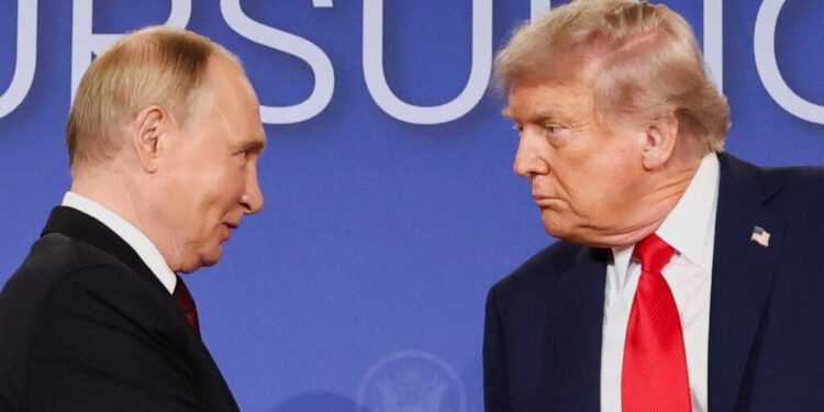 U.S. President Donald Trump and Russian President Vladimir Putin look at each other during a press conference following their meeting to negotiate an end to the war in Ukraine, at Joint Base Elmendorf-Richardson, in Anchorage, Alaska, U.S., August 15, 2025. REUTERS/Kevin Lamarque     TPX IMAGES OF THE DAY