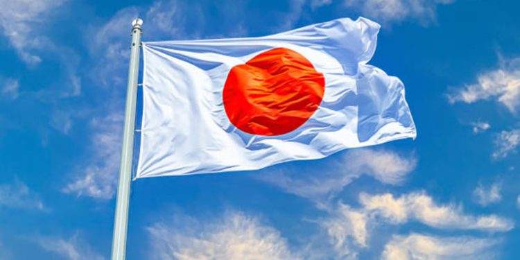 Japanese state flag waving on the wind against the sky